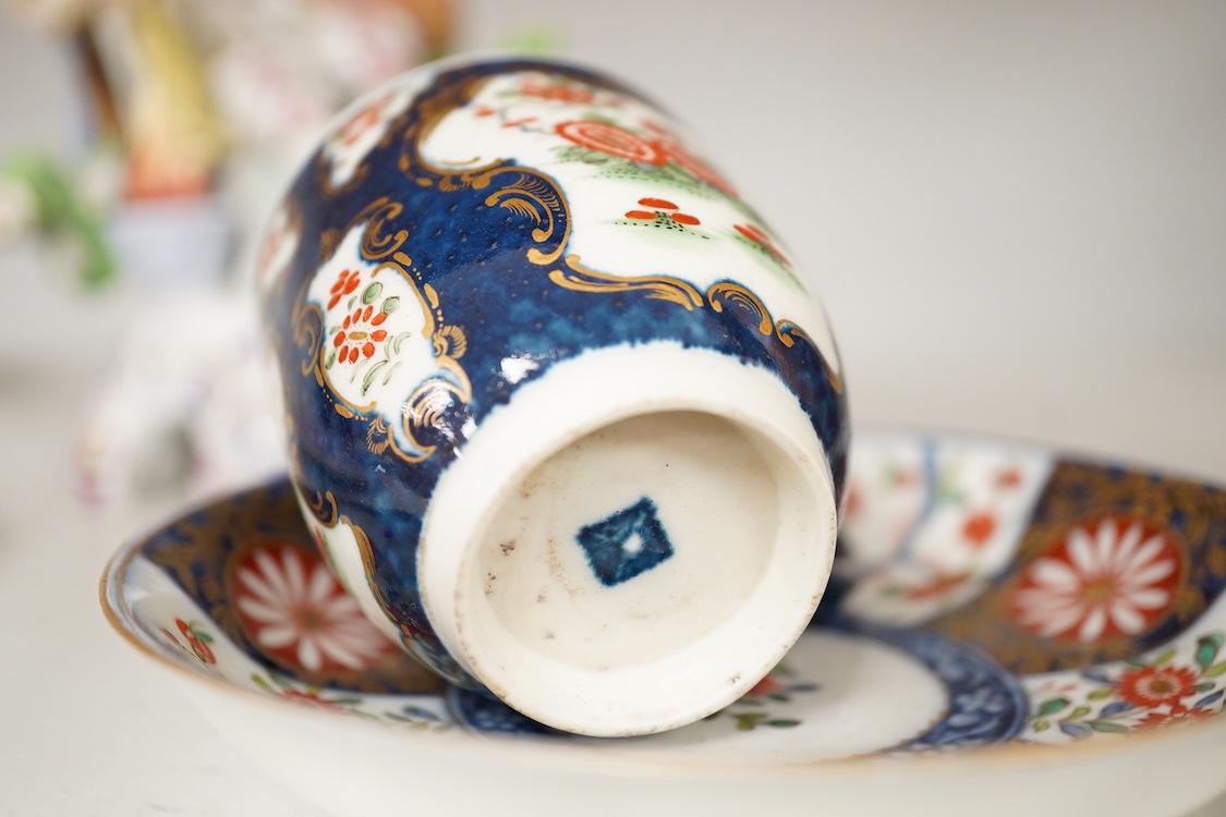 A Worcester Queen Charlotte pattern plate, Worcester scale blue coffee cup and teabowl, two French porcelain scale blue saucers, a fruit painted oval dish and a model of a boy emblematic of winter-19cm high